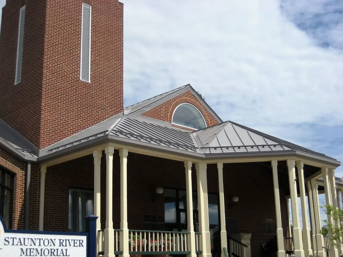 Skilled roofing craftsmen working on a residential roof in Lawrence